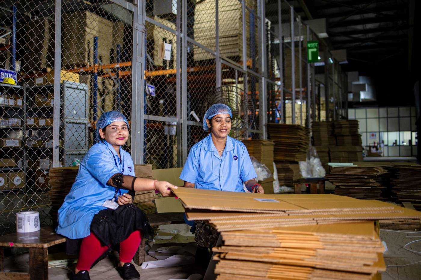 Amazon warehouse workers packing