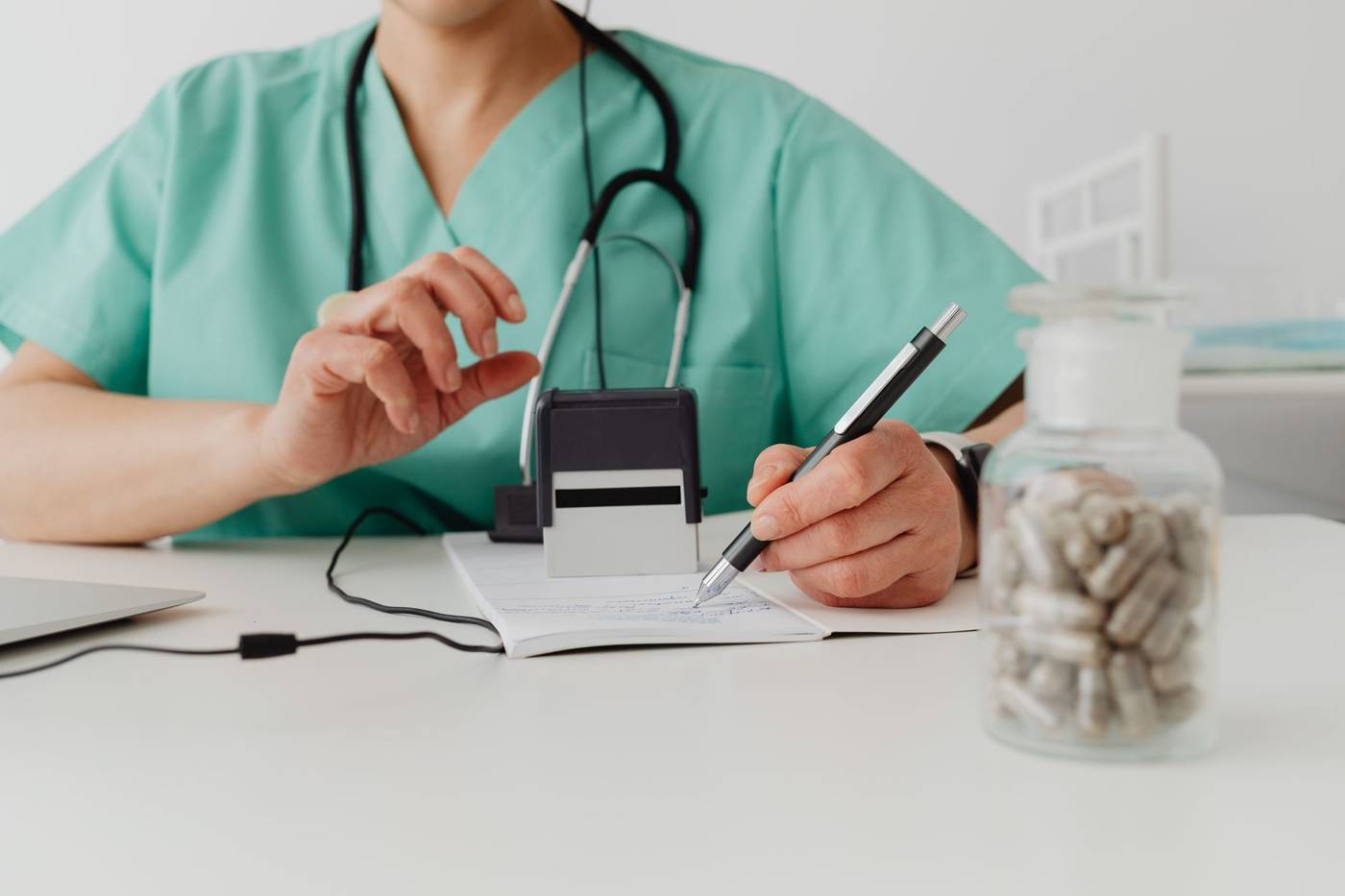 Doctor writing prescription