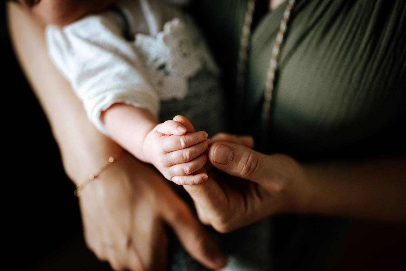 Parent holding newborn baby