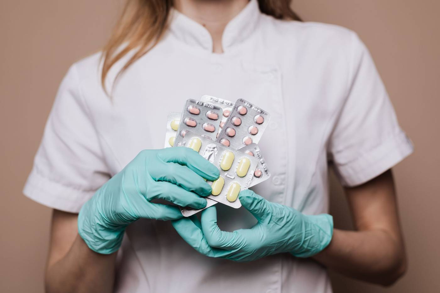 Pharmacist holding medication box
