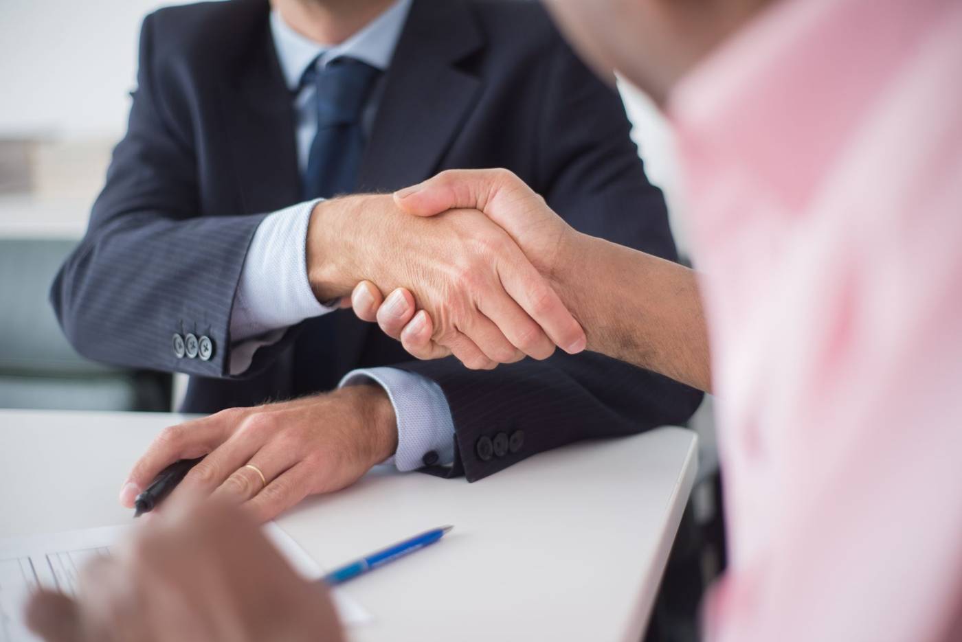 Trade negotiators shaking hands